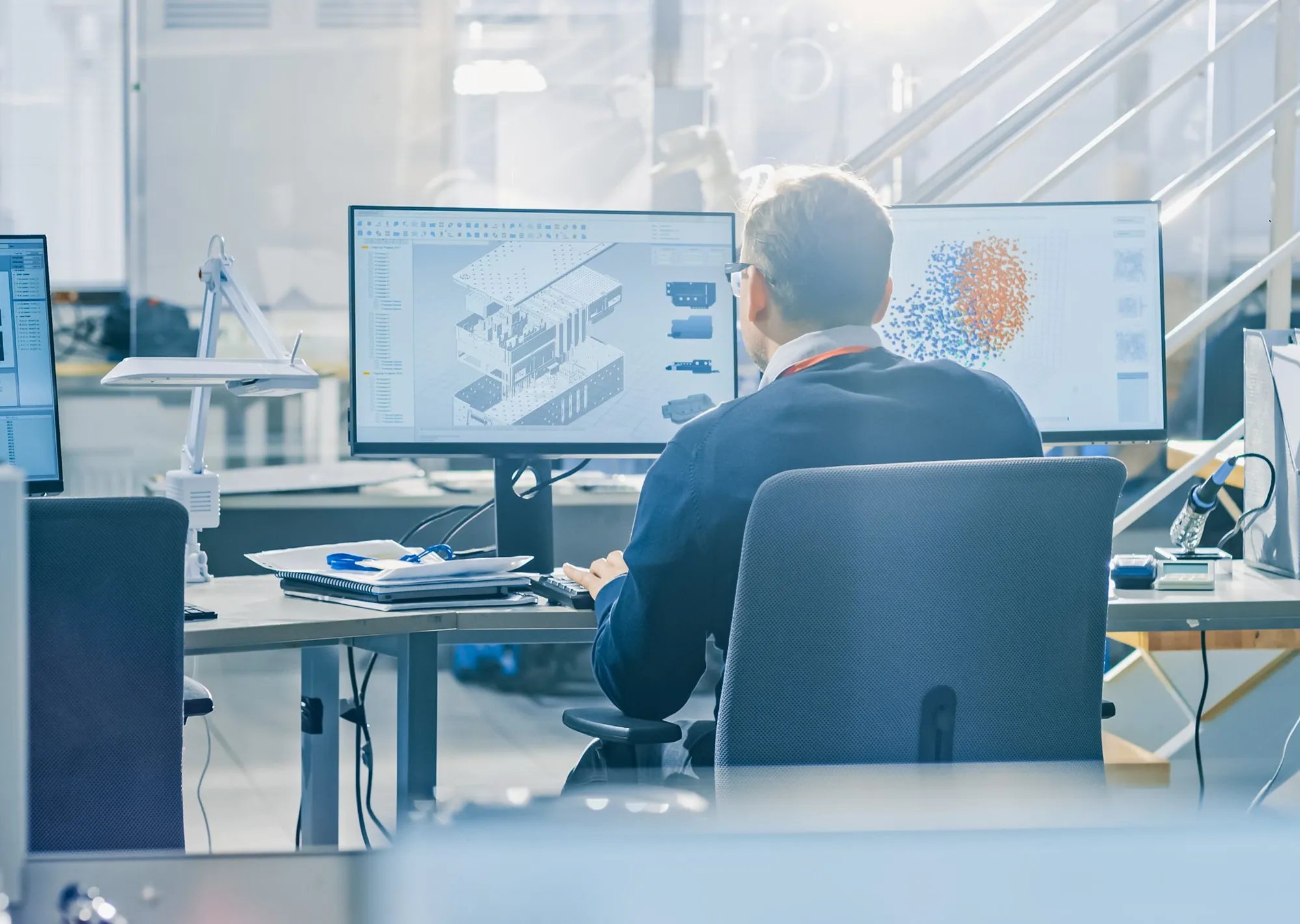 Paragon Medical design engineer reviewing custom surgical tray CAD models