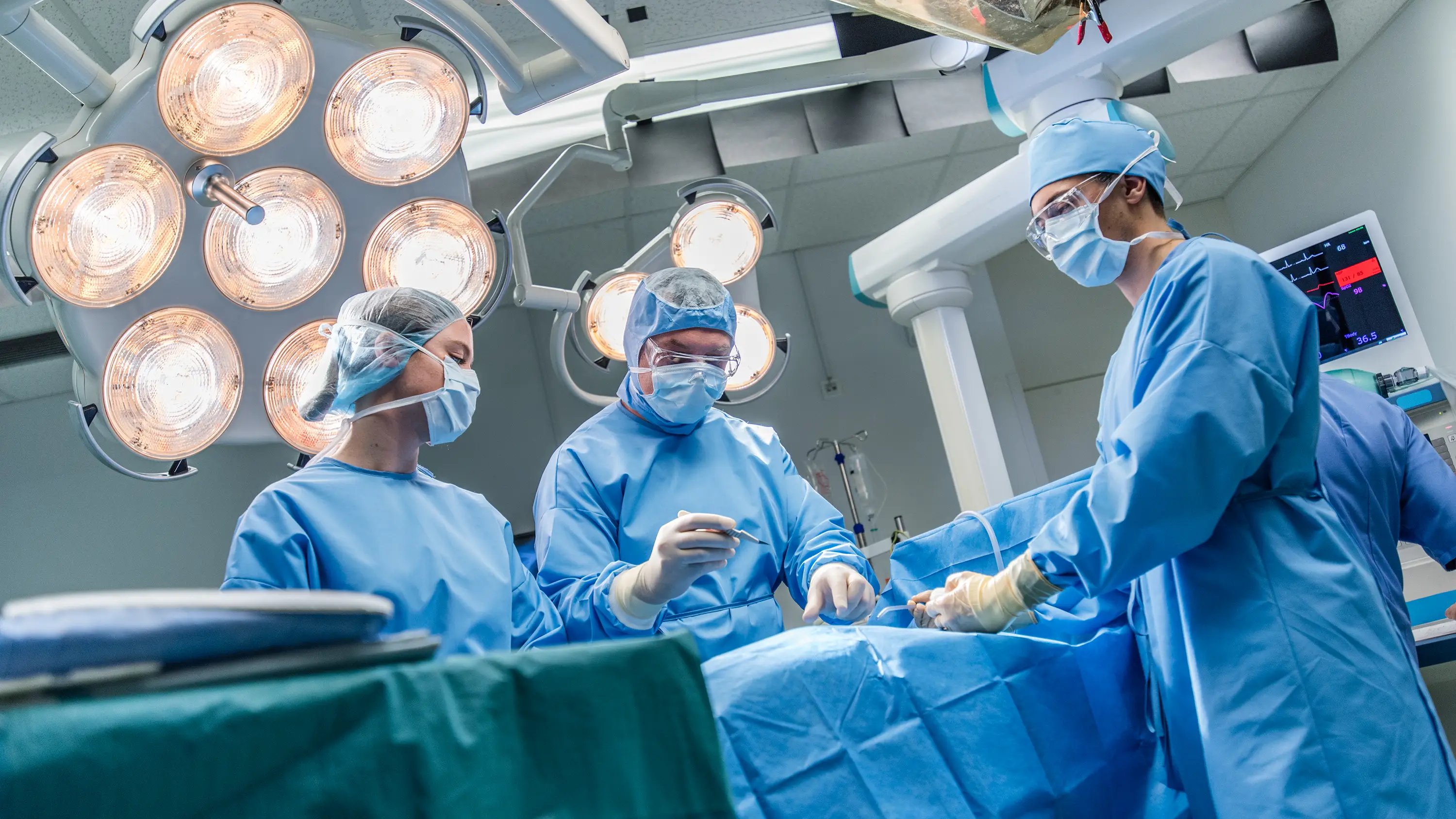 Surgeons conducting complex surgical procedure using precision instruments and implants manufactured by Paragon Medical